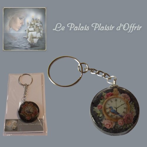 Porte-clef - résine - galet plat noir son horloge fleuri et l'oiseau