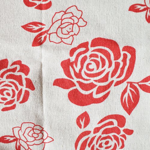 Coupon de tissu épais en coton et lin motifs fleurs rouges mono couleur 