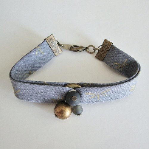 Bracelet biais france duval "orageux motifs libellules dorées", perles polaris et ccb, fermoir en métal bronze.