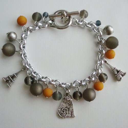 Bracelet breloques : tour eiffel et chat, perles polaris "black diamond", perles en verre pressé gris et jaune, ccb.