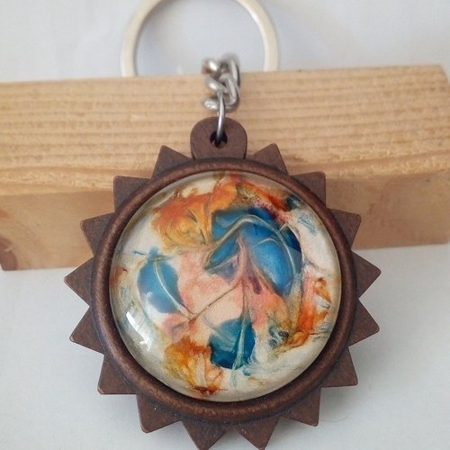 Porte cle, bois fleuri tournesol avec gros cabochon rond en verre peint bleu orange nacre rose,acier inoxydable