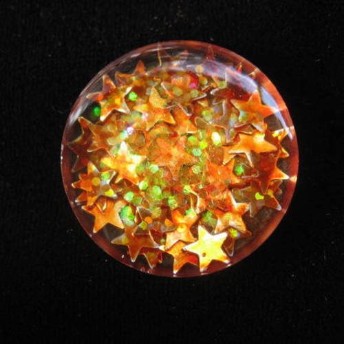 Bague ajustable unisexe étoiles oranges en résine diamètre 25mm