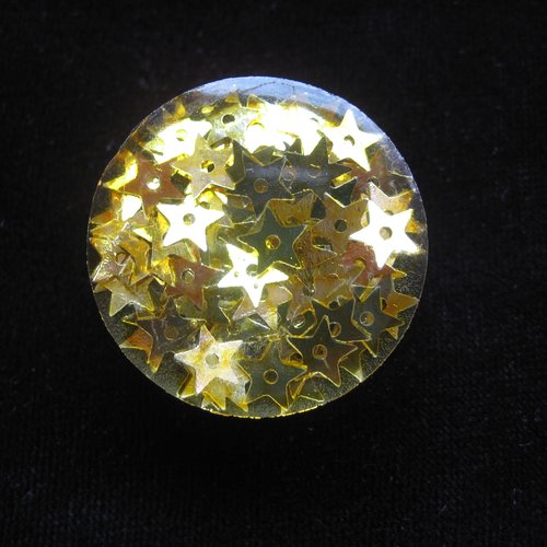 Bague ajustable unisexe étoiles dorées sur fond transparent en résine diamètre 25mm