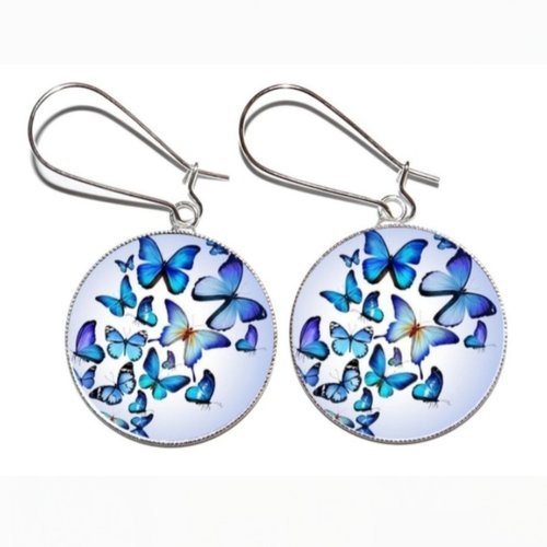 Boucles d’oreilles argentées *envol des papillons bleus* avec cabochons en résine