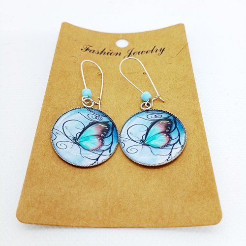 Boucles d’oreilles argentées avec cabochons en résine * papillons volutes*