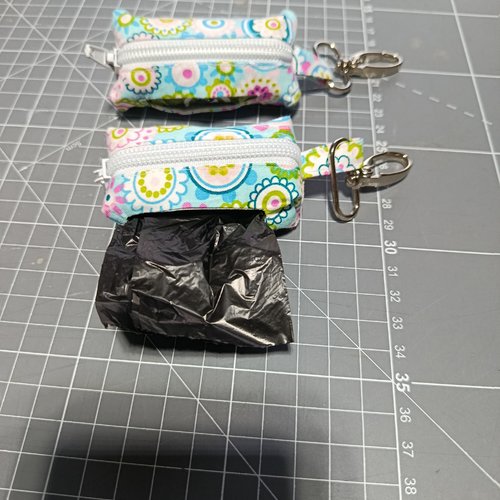 Porte clé sac à crottes