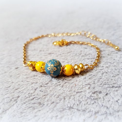 1 bracelet perle en verre jaune, et en bois vieux bleu, fermoir mousqueton, chaîne, d’extension en métal acier inoxydable doré