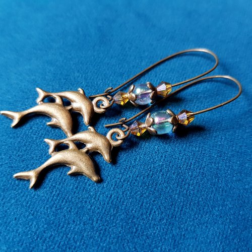 Boucle d'oreille dauphins, perles en verre transparent avec reflets, coupelles, crochets en métal bronze