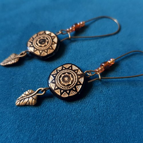 Boucle d'oreille perles en acrylique noir, doré, connecteur feuille, crochet en métal bronze