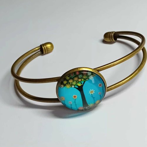 Bracelet arbre fleuri sur fond turquoise