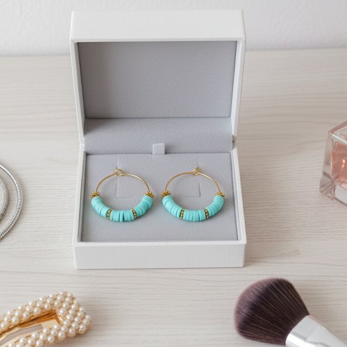 Boucles d'oreilles créoles dorées acier inoxydable et perles heishi