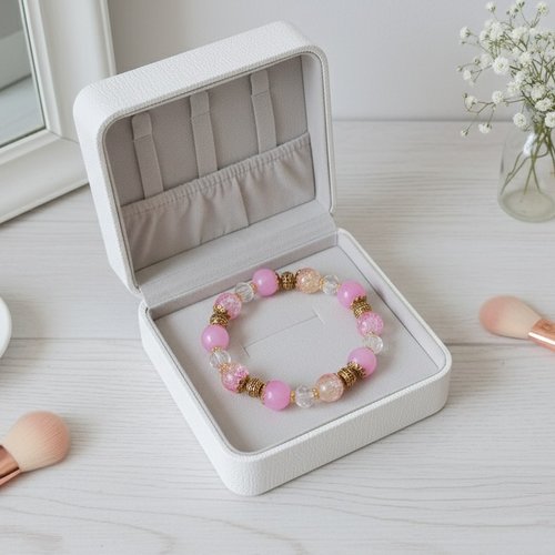 Bracelet fil élastique perles en verre rose et craquelé