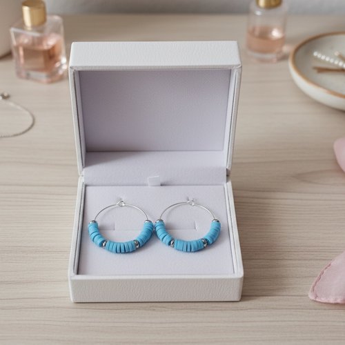 Boucles d'oreilles créoles argentées et perles heishi