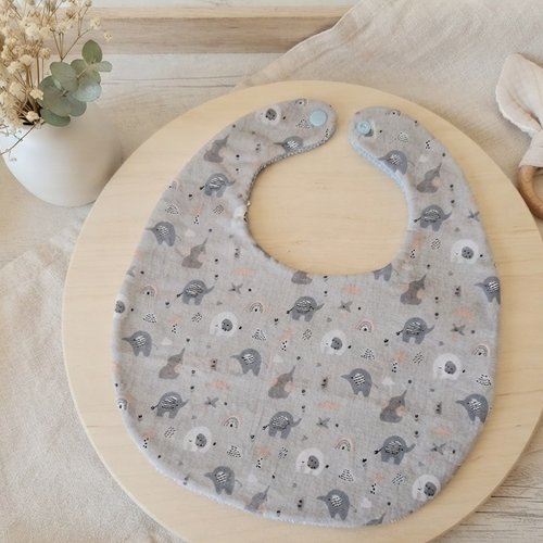 Bavoir bébé coton bleu motif éléphants et éponge bleue