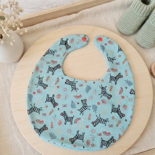 Bavoir bébé coton bleu motifs zèbres et éponge bleue