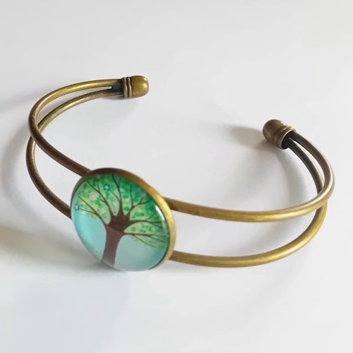 Bracelet jonc ouvert doré avec cabochon “arbre de vie”