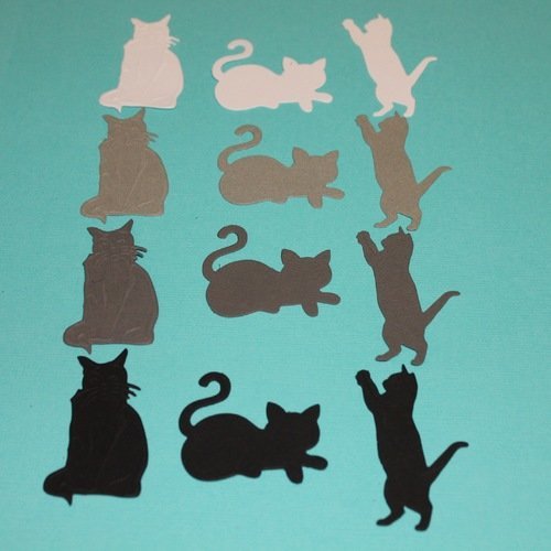 Lot de 12 découpes " petits chats " de différentes couleurs et formes .