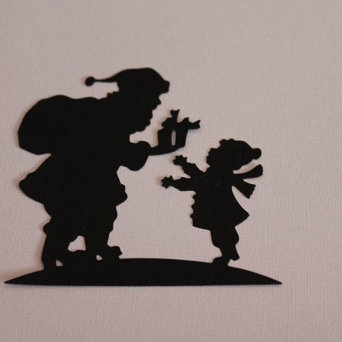 Découpe scrapbooking silhouette  " l' enfant et le père noel  "