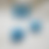 Perles  tête bouddha bleu corail de synthèse 15mm