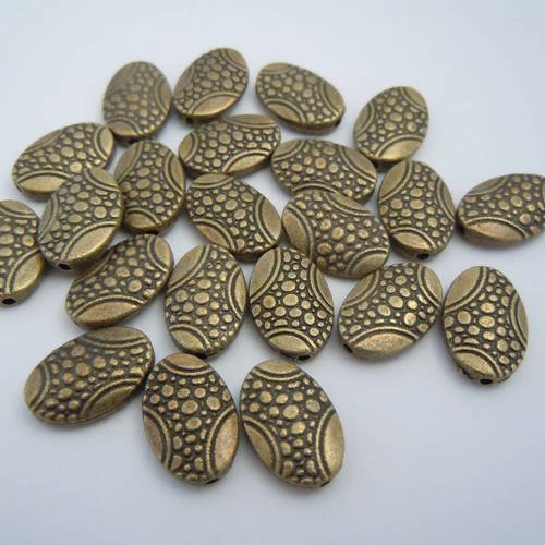 Perles bronze  pastilles ovales avec motifs  14x10mm