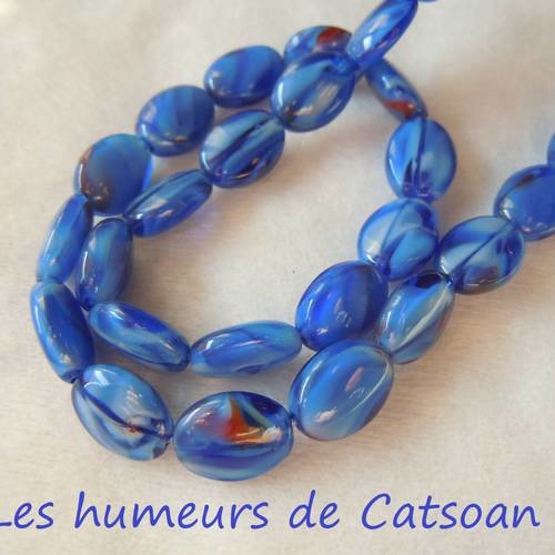 10 perles plates de couleur  bleue et noire 