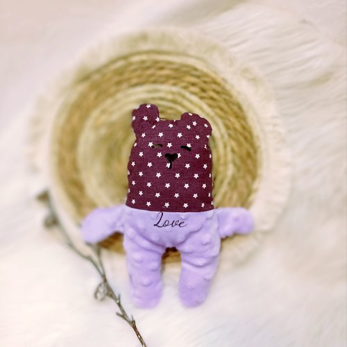Joli doudou ourson violet et étoiles