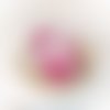 Joli doudou mou lapin rose motif arc en ciel
