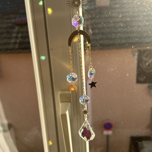 Attrape soleil dorée en acier de forme lune inversé