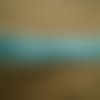 Deux mètres de ruban en synthétique , coloris turquoise , bordures argentées , largeur 11 mm