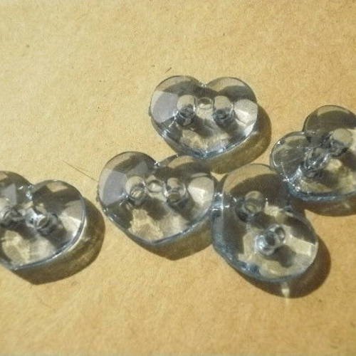 Petits boutons à deux trous en plastique transparent  , en forme de coeur, coloris bleu 
