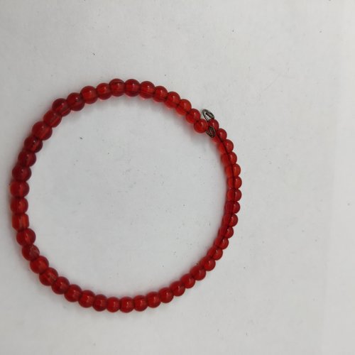 Bracelet jonc réglable orné de perles rouges