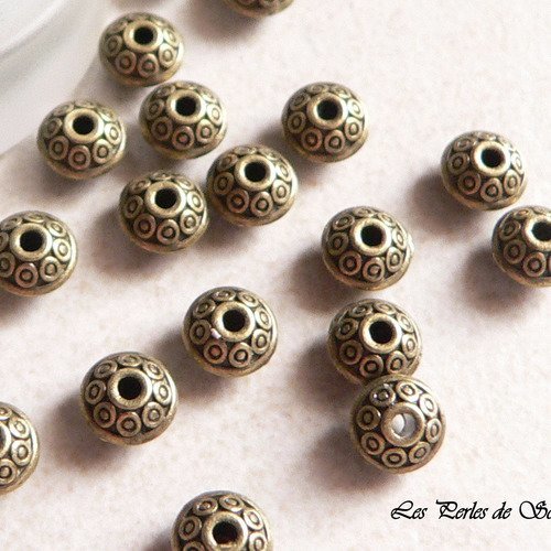 25 perles toupies en metal couleur bronze antique décor fleur 6mm 