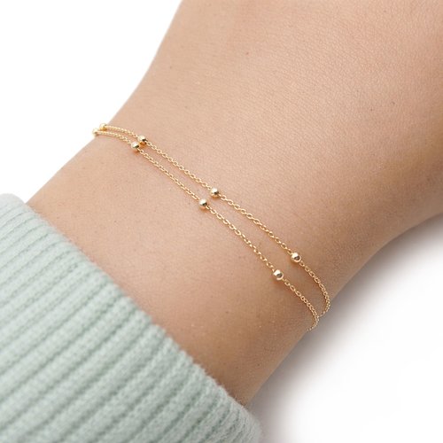 Bracelet en or 18 carats multirang double chaîne perlée