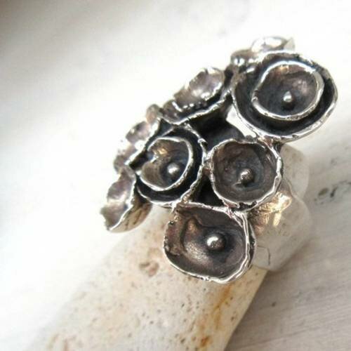 Vendu -  ---une bague argent massif 925 avec des fleurs stylisées ....