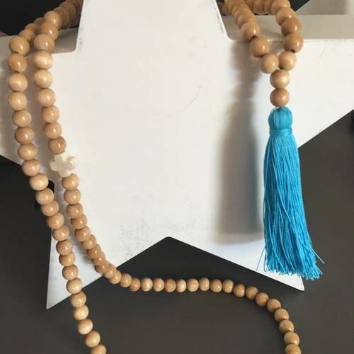 Collier bohème en perles bois et pompon turquoise