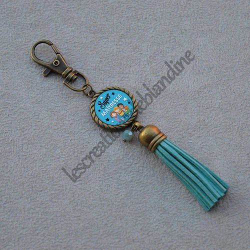Porte clés spécial maitresse+ carte offerte pompon en daim, perle en cristal 