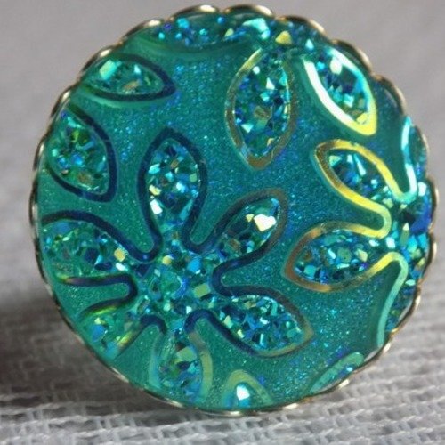 Bague argent ajustable,cabochon en résine motif fleurs pailletées de coloris bleu.