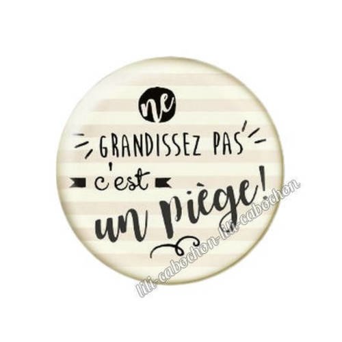 Cabochon résine a coller 25 mm texte ne grandissez pas c'es un piège