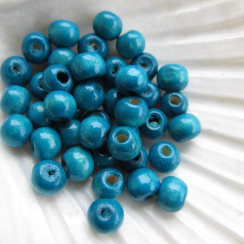 Lot de 50 perles de 8 mm de diamètre en bois peint de couleur: bleu canard. 