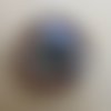 Cabochon en verre de forme ronde de 25 mm de diamètre avec image de fond décor kaléidoscope.