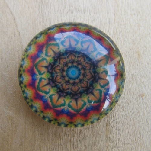 Cabochon en verre de forme ronde de 25 mm de diamètre avec image de fond décor kaléidoscope.