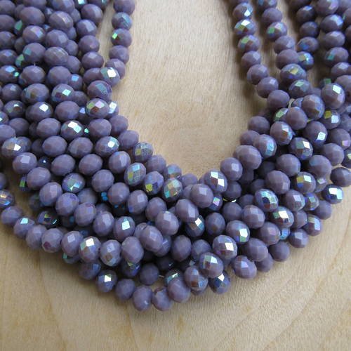 Lot de 50 perles forme boulier en verre à facettes de 6 x 4 mm de couleur: violine/ reflets turquoise. 