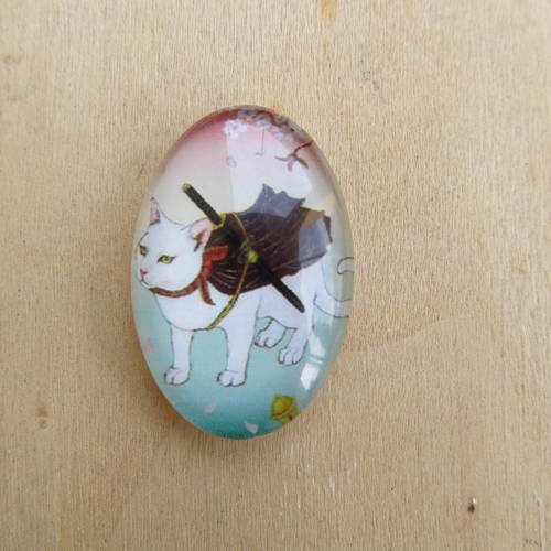Cabochon en verre de forme ovale de 30 x 20 mm avec image de fond décor: dessin de chat. 