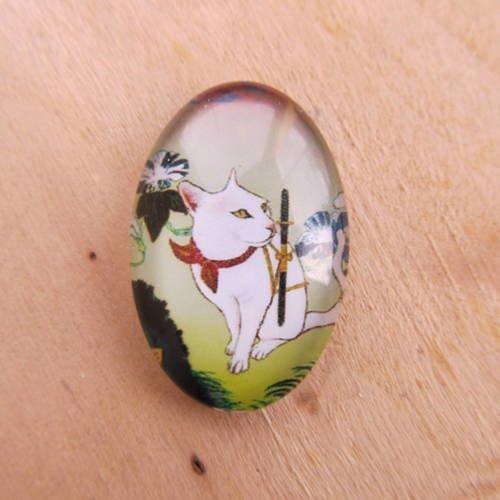 Cabochon en verre de forme ovale de 30 x 20 mm avec image de fond décor: dessin de chat.