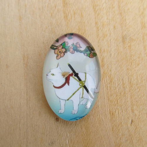 Cabochon en verre de forme ovale de 30 x 20 mm avec image de fond décor: dessin de chat. 