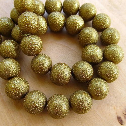 Perles en verre nacré doré effet granité. 