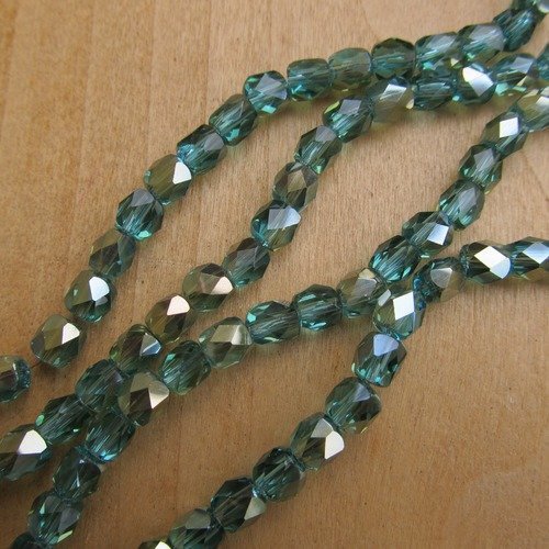 *lot de 10 perles de 6 x 6 mm, forme "tonneau", en verre à facettes, de couleur: bleu topaze.