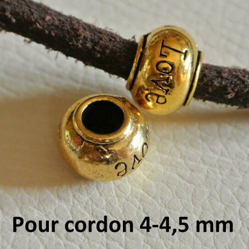 2 perles passantes dorées, 11 x 8 mm, forme rondelle avec bourrelet et inscription love, trou 5 mm 