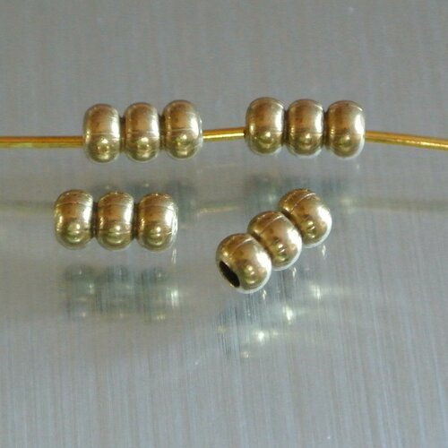 30 perles intercalaires métal doré forme tube aspect superposition de 3 perles