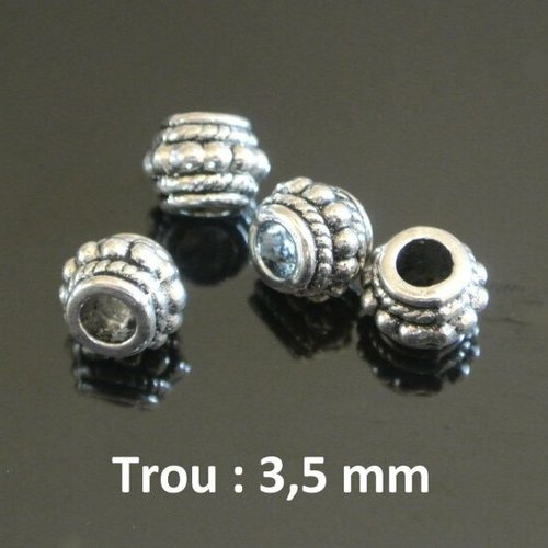 Dix perles passantes argentées, décor rondelles à points centraux, 6 x 8 mm, trou 3,5 mm 